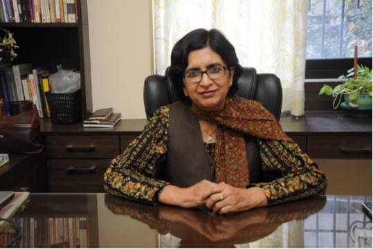 Rita Aggarwal receiving Rotary International Award for 'Wellness in a Box' mental health initiative.