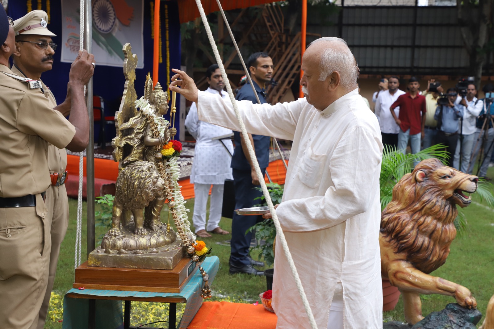RSS Chief Mohan Bhagwat hoisting the national flag at the RSS Headquarters on Independence Day, symbolizing unity and national pride.