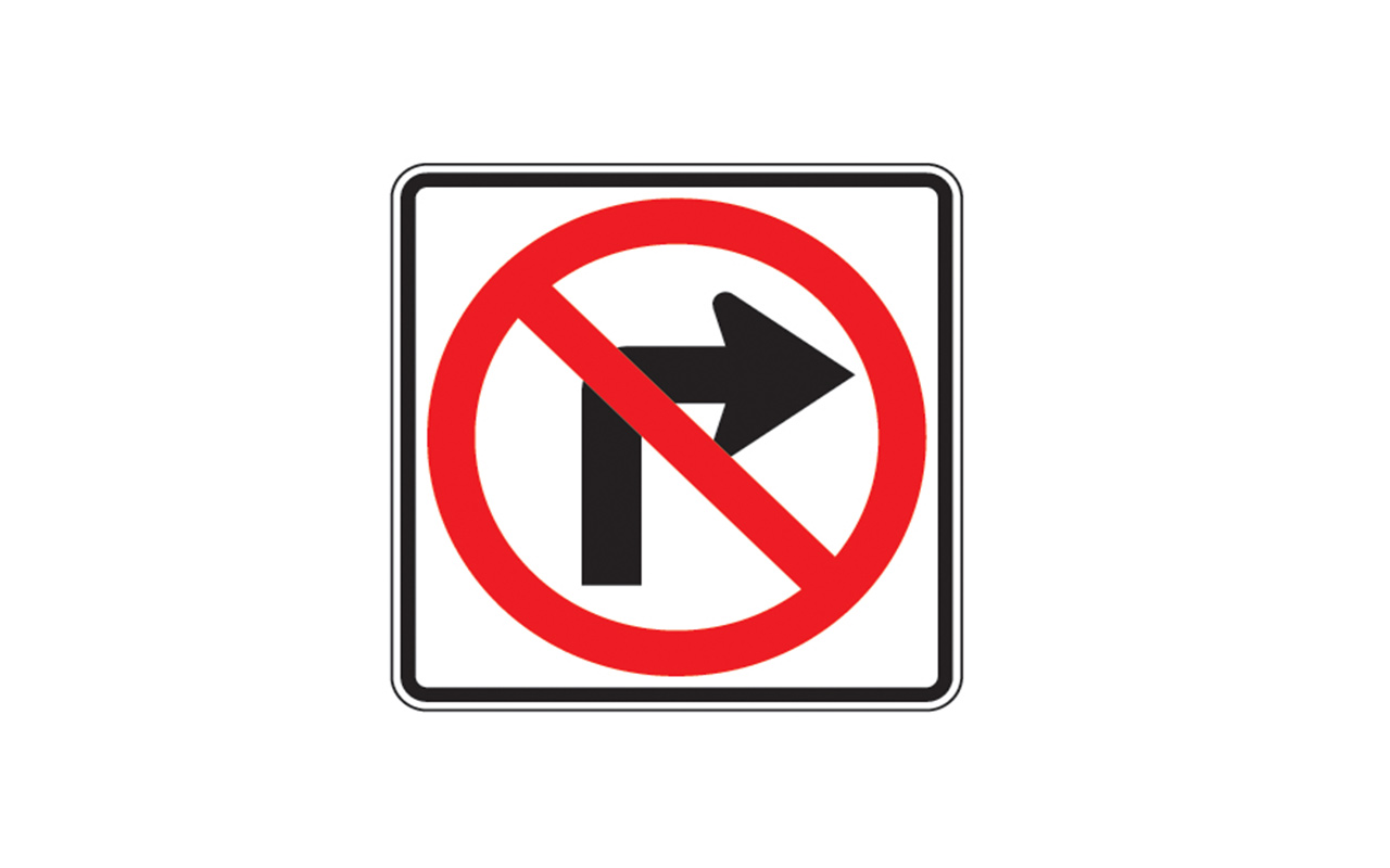 Morris College: Traffic sign at Ajni Square showing no right turn during peak hours, with vehicles moving smoothly under new rules.