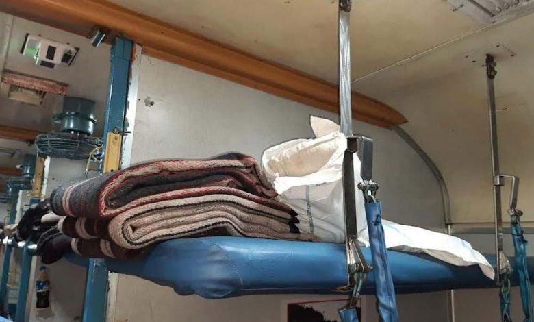 RAC passengers receiving bed rolls in AC coach
