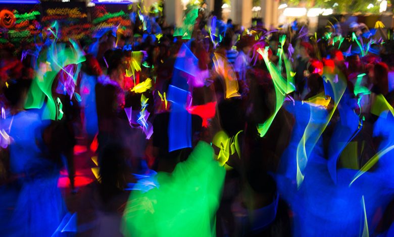 MIDC Police Station , Nagpur: A bustling dance bar scene with pink disco lights and officers raiding.