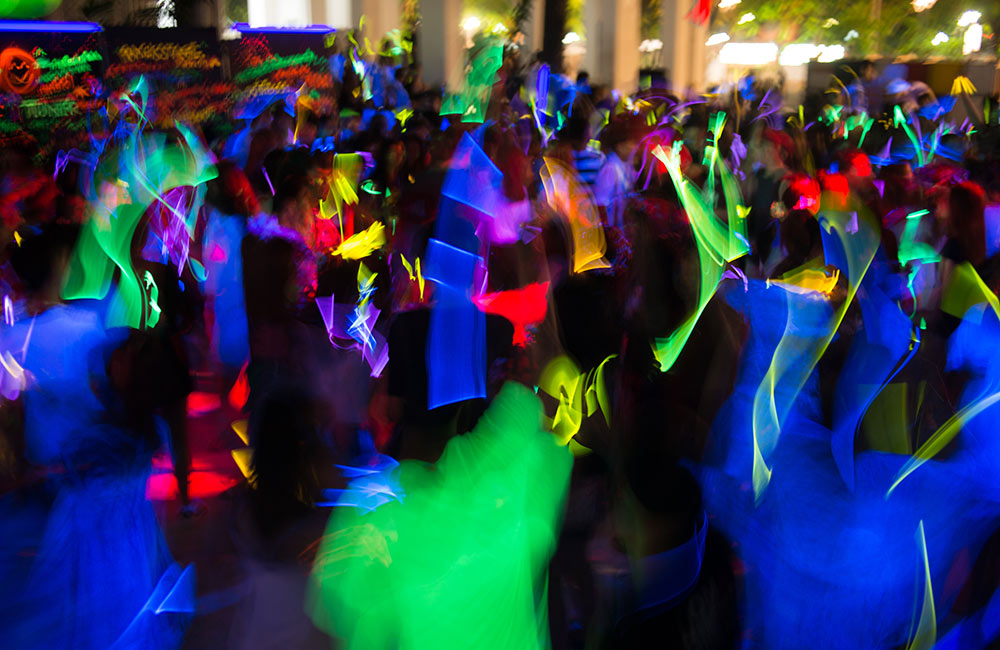 MIDC Police Station , Nagpur: A bustling dance bar scene with pink disco lights and officers raiding.