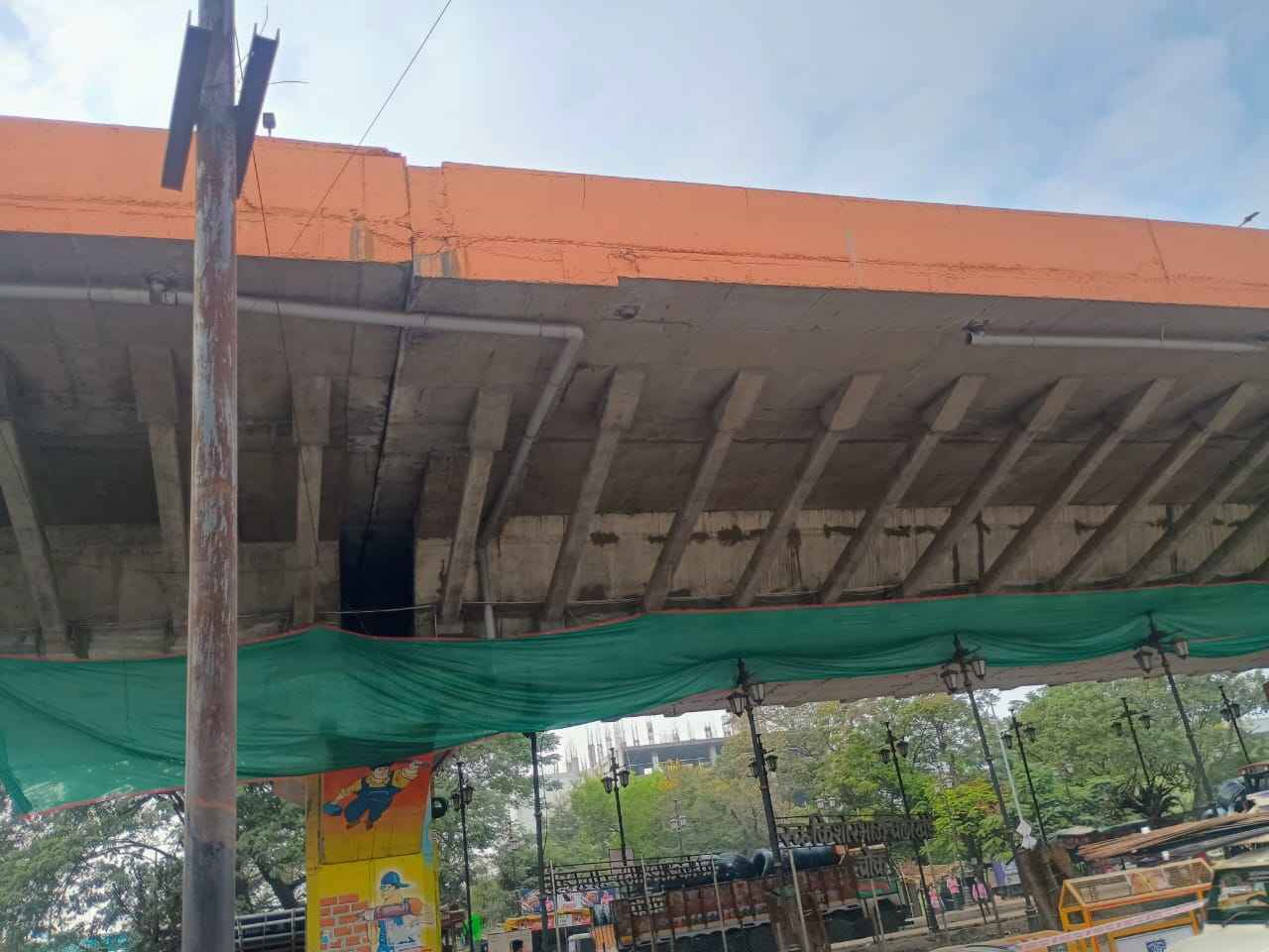 Nagpur: Damaged Butibori flyover section under inspection with visible cracks and exposed iron bars.