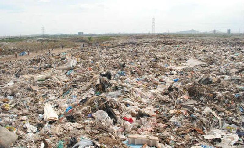 A reclaimed landfill at Bhandewadi showcasing greenery and eco-friendly projects. | Bhandewadi biomining project Nagpur.