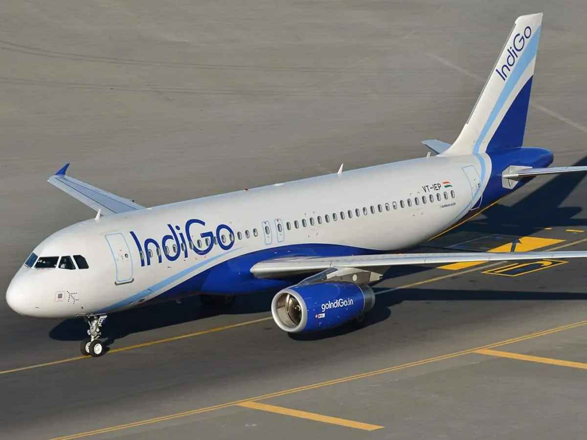IndiGo aircraft at the airport, representing the new direct flight route between Pune and Prayagraj.