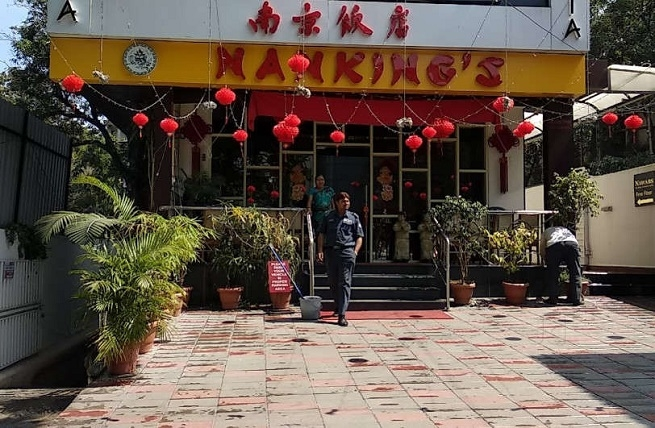 NMC fire safety officials outside Nanking Hotel Nagpur after sealing the premises over fire NOC and safety compliance violations