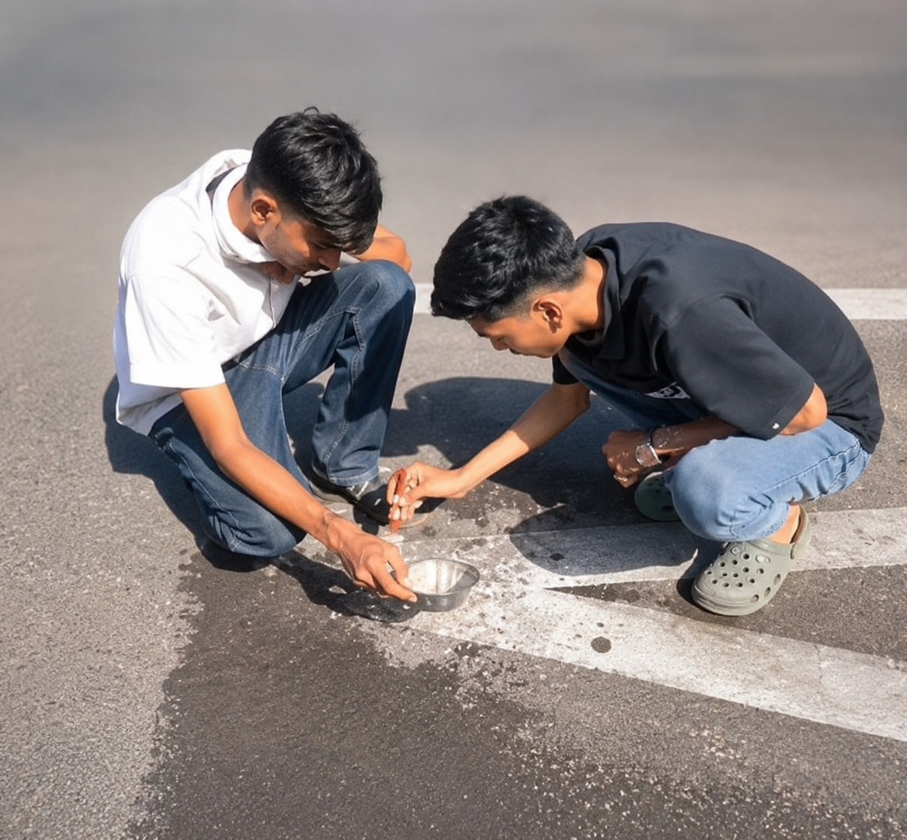 Shegaon engineering students Rajvardhan Thakur and Atharv Deshmukh demonstrate bio-based self-healing road and glow-based night visibility technology near Sant Gajanan Maharaj Temple Shegaon 2026